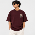 Known Clothing Living For Deadlines maroon oversized t-shirt front view on model