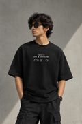 Known Clothing Powered by UPI and Caffeine black oversized t-shirt front view on model  