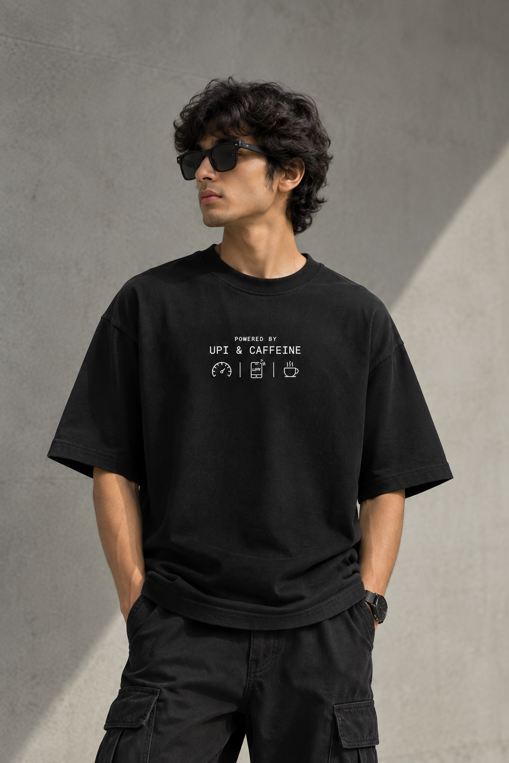 Known Clothing Powered by UPI and Caffeine black oversized t-shirt front view on model  