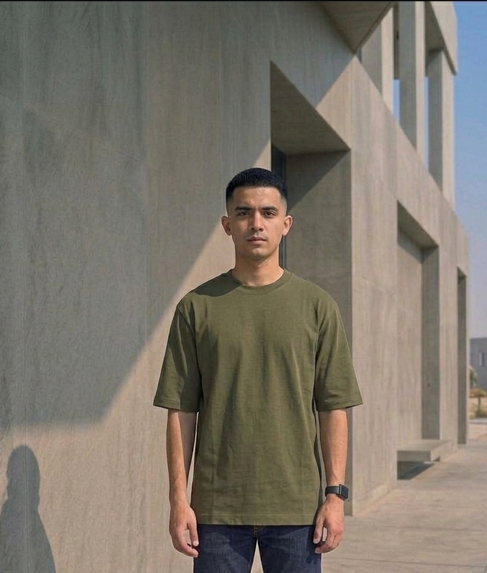 Known Clothing green oversized t-shirt front view on male model outdoor setting