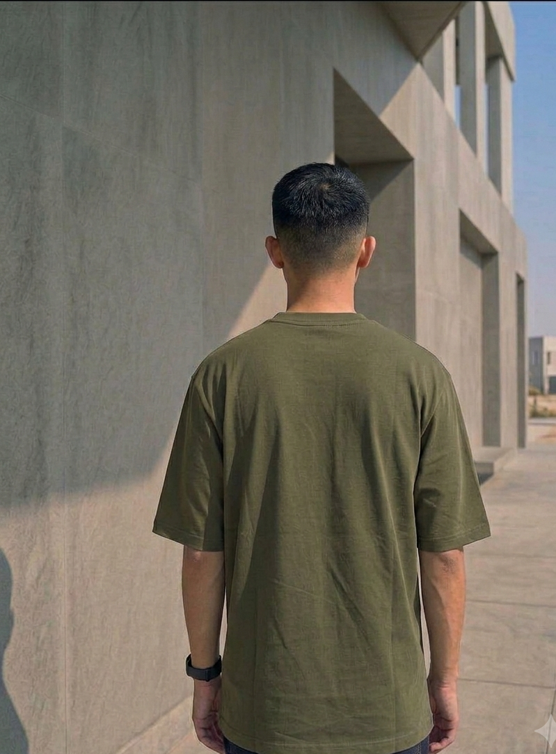 Known Clothing green oversized t-shirt back profile view on male model
