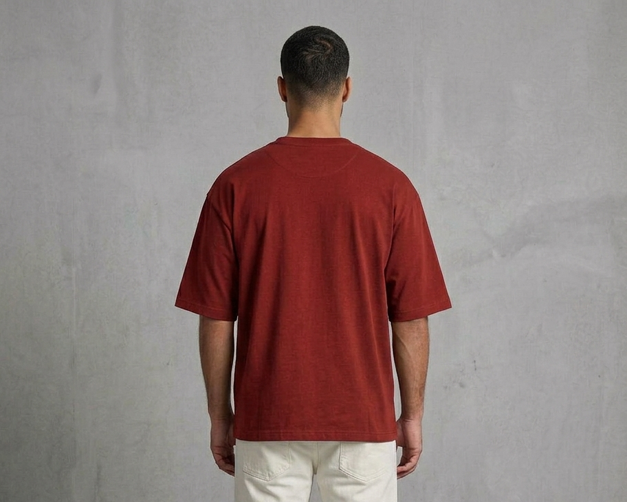 Known Clothing rust red oversized t-shirt back view on male model